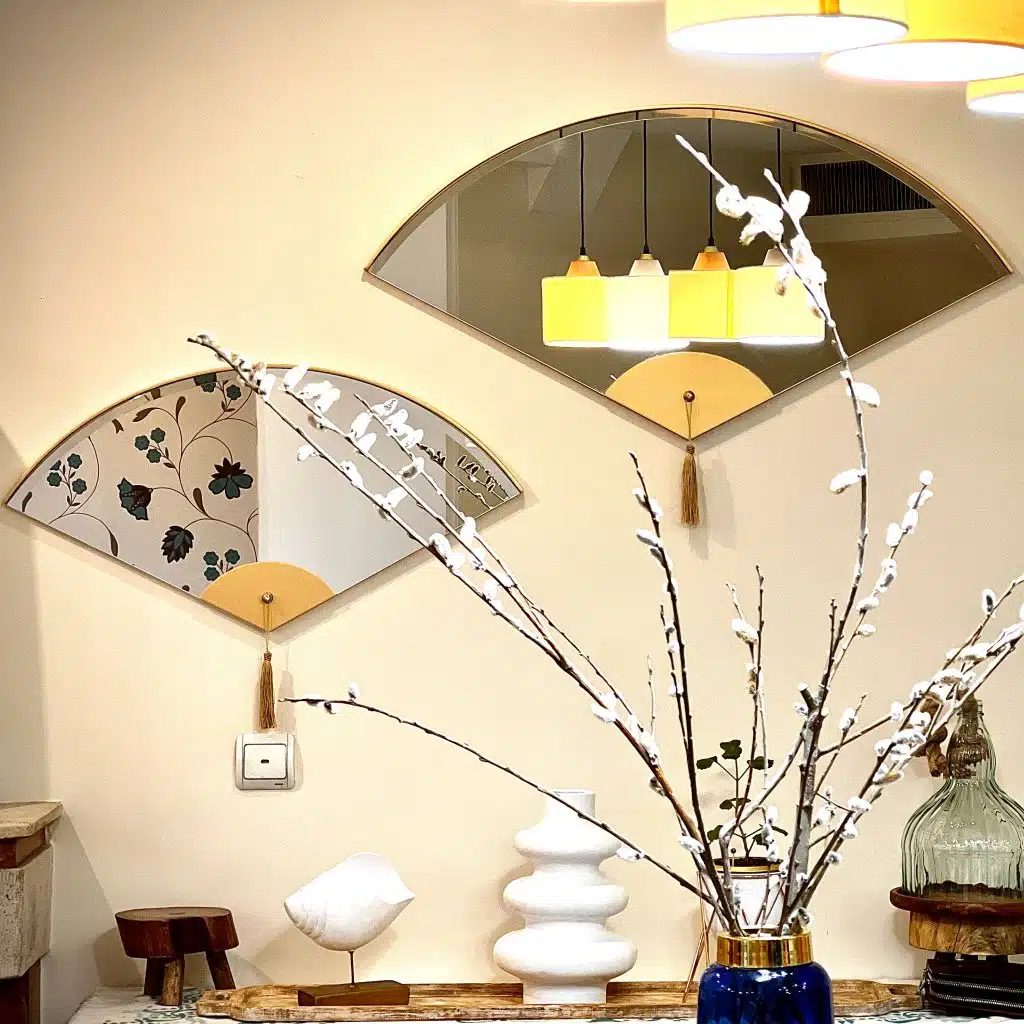 Add a touch of modern elegance to your living room décor with this unique asymmetrical mirror. Perfect for adding a contemporary flair to any space, this irregular fan-shaped mirror is both stylish and functional. Whether it's hanging in the bathroom as a vanity mirror or displayed in the living room as a statement piece, this mirror is sure to impress. Available in both large and small sizes, it also makes a thoughtful housewarming gift for your loved ones. Upgrade your home with this modern and minimalistic mirror today!