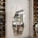 Unique irregular leaner full-length wall mirror showcasing an asymmetrical design for modern home decor.
