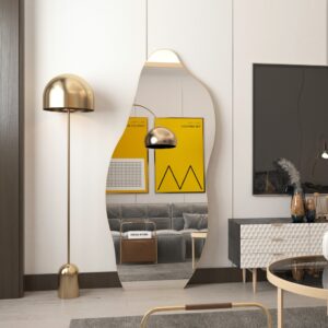 Full-length asymmetrical floor mirror leaning against the wall, featuring an irregular shape for a distinctive look