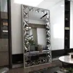 Elegant silver rectangular mirror with prism-shaped artwork, perfect for modern and classic interiors.