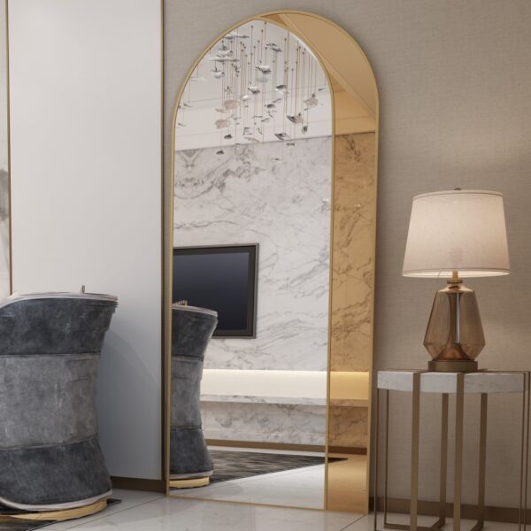 Add a touch of contemporary elegance to your living space with this Modern Arched Floor Mirror. This full-length lean wall mirror features an asymmetrical design, perfect for adding a chic flair to your housewarming decor. Use it as a leaner mirror in your bedroom or living room to create the illusion of a larger space while adding a stylish statement piece. Elevate your home decor with this stunning and sleek large mirror that will instantly upgrade any room in your house.