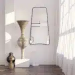 Elevate your home decor with this stunning Wavy Asymmetrical Gold Wall Mirror. Perfect for adding a touch of modern chic flair to your bathroom vanity or living room, this elegant and irregularly shaped mirror will instantly upgrade the aesthetic of any space. The sophisticated gold frame adds a touch of luxury, making it a stylish and versatile addition to your home decor. Make a statement with this unique and eye-catching piece that is sure to become a focal point in any room.