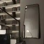 Elevate your space with this stunning Wavy Asymmetrical Gold Wall Mirror. This modern chic home decor piece is perfect for adding a touch of elegance to your bathroom vanity or living room. The irregular shape of the mirror creates a unique and eye-catching design element, setting it apart from traditional mirrors. Bring a touch of luxury to your home with this elegant vanity aesthetic that will surely enhance any room's aesthetic.