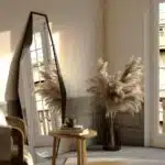 Add a touch of modern elegance to your chic home with this stunning Modern Full-Length Free Standing Irregular Gold Mirror. The unique asymmetrical design makes it a standout piece, perfect for any room in your home. This irregular full-body mirror is not only functional but also adds a sophisticated aesthetic to your space. Whether you place it in your large bathroom as a vanity mirror or use it as a statement piece in your living room, this mirror is sure to impress. It also makes a great housewarming gift for friends and loved ones who appreciate stylish decor. Elevate your space with this eye-catching mirror that combines form and function seamlessly.