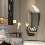 Add a touch of modern elegance to your space with this stunning ASYMMETRICAL VANITY MIRROR. This unique piece features an Irregular Mirror design that is perfect for adding a stylish flair to your Entryway or Bathroom. The Gold Wall Mirror adds a glamorous touch, while the Large Mirror size makes it perfect for wall décor or as a Full length Mirror. Elevate your home decor with this chic and versatile piece that is sure to make a statement in any room.