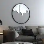 Add a touch of sophistication to your living space with this Round Decorative Vanity Mirror. This unique design mirror is perfect for adding character to your living room decor, making it an ideal housewarming gift. The statement piece features a modern design that doubles as chic wall art, elevating any room with its minimalist stylish look. Bring a touch of elegance to your home with this contemporary wall mirror.