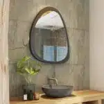 Elevate your space with this stunning Mid Century Asymmetrical Black Mirror. This Irregular Bathroom Vanity Mirror is the perfect addition to any stylish Living Room Décor. The large size makes it ideal as a statement piece or as a practical Housewarming Gift for her. Add a touch of sophistication to your home with this unique and modern wall mirror.