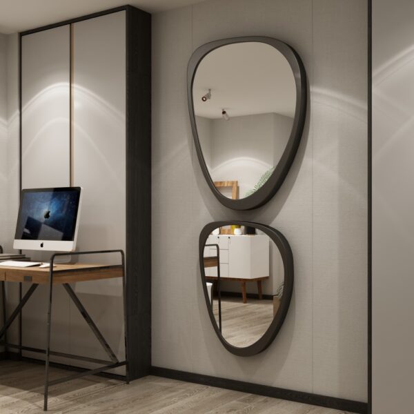 Add a touch of modern elegance to your space with this Mid Century Asymmetrical Black Mirror. This striking piece features an irregular design, making it a unique addition to any room. Whether used as a bathroom vanity mirror or as stylish living room décor, this large wall mirror is sure to make a statement. Perfect for her, this mirror also makes a thoughtful housewarming gift for that special someone who loves contemporary style. Elevate your decor with this one-of-a-kind piece that combines functionality with fashion.