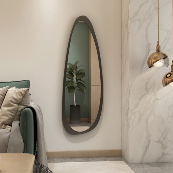 Add a touch of modern elegance to your space with this Mid Century Asymmetrical Black Mirror. This Irregular Bathroom Vanity Mirror is perfect for adding a stylish touch to your living room décor. The large size makes it a statement piece that is sure to impress. Whether you're looking for a unique mirror for her, or searching for the perfect housewarming gift, this mirror is the perfect choice. Handcrafted with care, this mirror is a stunning addition to any home.