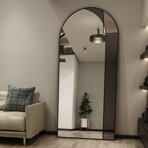 Add a touch of modern elegance to your living room with this stunning Modern Arched Floor Mirror. This full-length lean wall mirror features an asymmetrical design that adds a chic and unique element to your home decor. Perfect for a housewarming gift or to elevate your own space, this leaner mirror is both stylish and functional. The large mirror size makes it perfect for checking your outfit or brightening up your living space. Make a statement with this beautiful vanity floor mirror that will surely impress your guests.