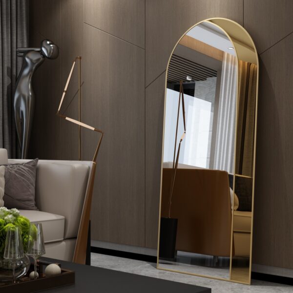 Add a touch of modern sophistication to your living room with this stunning Modern Arched Floor Mirror. This full-length lean wall mirror features an asymmetrical design, perfect for adding a unique and chic touch to your home decor. Whether used as a leaner mirror in your bedroom or as a statement piece in your living room, this large mirror is sure to elevate any space. Ideal as a housewarming gift, this vanity floor mirror combines style and functionality for a truly elegant addition to your home.