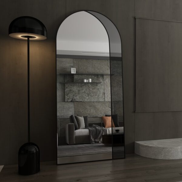 Add a touch of modern sophistication to your living room with this stunning Modern Arched Floor Mirror. This full-length lean wall mirror features an asymmetrical design, perfect for adding a unique and chic touch to your home decor. Whether used as a leaner mirror in your bedroom or as a statement piece in your living room, this large mirror is sure to elevate any space. Ideal as a housewarming gift, this vanity floor mirror combines style and functionality for a truly elegant addition to your home.