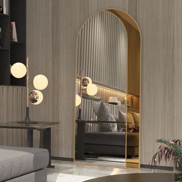 Add a touch of contemporary elegance to your living space with this Modern Arched Floor Mirror. This full-length lean wall mirror features an asymmetrical design, perfect for adding a chic flair to your housewarming decor. Use it as a leaner mirror in your bedroom or living room to create the illusion of a larger space while adding a stylish statement piece. Elevate your home decor with this stunning and sleek large mirror that will instantly upgrade any room in your house.