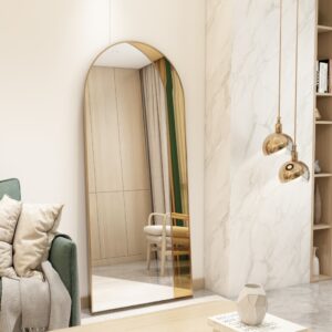 Add a touch of contemporary elegance to your living space with this Modern Arched Floor Mirror. This full-length lean wall mirror features an asymmetrical design, perfect for adding a chic flair to your housewarming decor. Use it as a leaner mirror in your bedroom or living room to create the illusion of a larger space while adding a stylish statement piece. Elevate your home decor with this stunning and sleek large mirror that will instantly upgrade any room in your house.