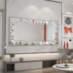 Elegant silver rectangular mirror with prism-shaped artwork, perfect for modern and classic interiors.