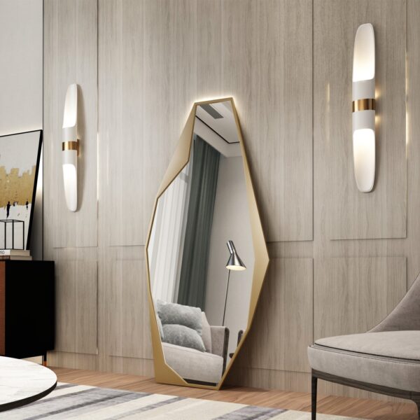 Add a touch of contemporary elegance to your living space with this Modern Full-Length Free Standing Irregular Gold Mirror. This Unique Asymmetrical Floor Mirror is not your average vanity mirror - its irregular shape and eye-catching design make it a standout piece of decor. Perfect for any room in your home, this Irregular Vanity Mirror will instantly elevate your space with its Aesthetic Design. Make a bold statement with this full body mirror that doubles as a stunning piece of art. Give your living room a stylish update with this striking and unique addition.