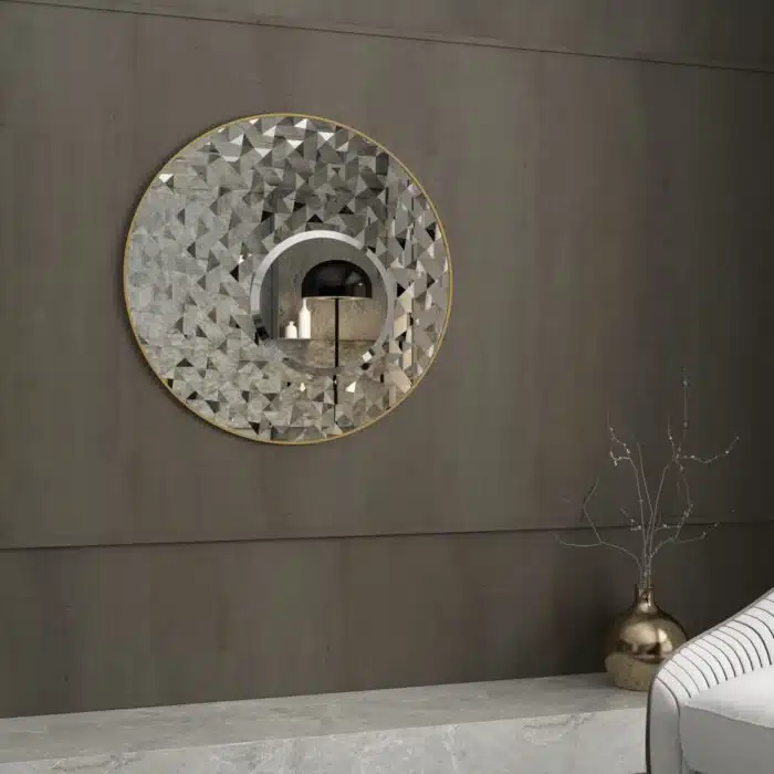 Add a touch of modern elegance to your living room or bathroom with this stunning Round Asymmetrical Mirror. This unique accent decor piece features a large circle wall mirror with a decorative sunburst style, making it the perfect statement piece for any space. Whether used as a bathroom vanity mirror or as a focal point in your living room, this mirror is sure to elevate your decor with its sleek and stylish design. Make a bold statement with this eye-catching mirror that seamlessly blends style and function.