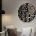 Introducing our stunning Round Asymmetrical Mirror, perfect for adding a touch of elegance to your living room decor or bathroom vanity. This unique accent decor piece features a large circle design in a decorative sunburst style, sure to catch the eye and elevate the aesthetic of any space. Whether hung on a wall or displayed on a dresser, this mirror is both functional and stylish, making it a must-have piece for your home. Brighten up your space with this statement mirror today!