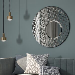 Introducing our stunning Round Asymmetrical Mirror, perfect for adding a touch of elegance to your living room decor or bathroom vanity. This unique accent decor piece features a large circle design in a decorative sunburst style, sure to catch the eye and elevate the aesthetic of any space. Whether hung on a wall or displayed on a dresser, this mirror is both functional and stylish, making it a must-have piece for your home. Brighten up your space with this statement mirror today!