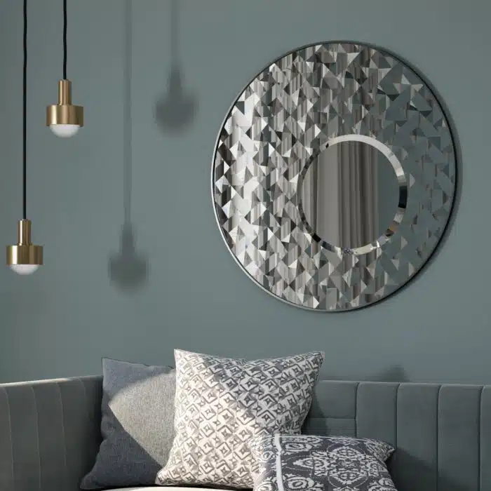 Introducing our stunning Round Asymmetrical Mirror, perfect for adding a touch of elegance to your living room decor or bathroom vanity. This unique accent decor piece features a large circle design in a decorative sunburst style, sure to catch the eye and elevate the aesthetic of any space. Whether hung on a wall or displayed on a dresser, this mirror is both functional and stylish, making it a must-have piece for your home. Brighten up your space with this statement mirror today!