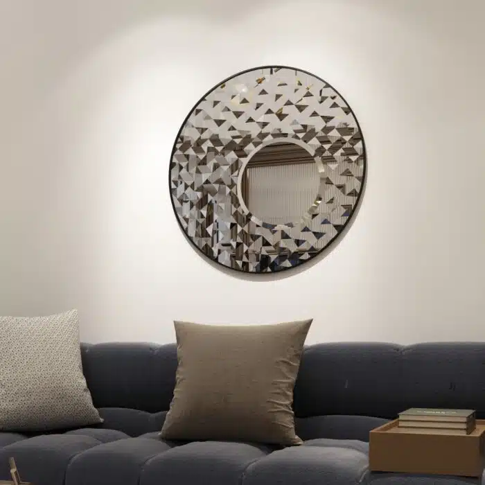 Add a touch of modern elegance to your living room or bathroom with this stunning Round Asymmetrical Mirror. This unique accent decor piece features a large circle wall mirror with a decorative sunburst style, making it the perfect statement piece for any space. Whether used as a bathroom vanity mirror or as a focal point in your living room, this mirror is sure to elevate your decor with its sleek and stylish design. Make a bold statement with this eye-catching mirror that seamlessly blends style and function.