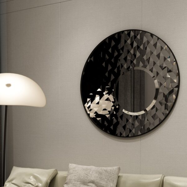 Add a touch of modern elegance to your living room or bathroom with this stunning Round Asymmetrical Mirror. This unique accent decor piece features a large circle wall mirror with a decorative sunburst style, making it the perfect statement piece for any space. Whether used as a bathroom vanity mirror or as a focal point in your living room, this mirror is sure to elevate your decor with its sleek and stylish design. Make a bold statement with this eye-catching mirror that seamlessly blends style and function.