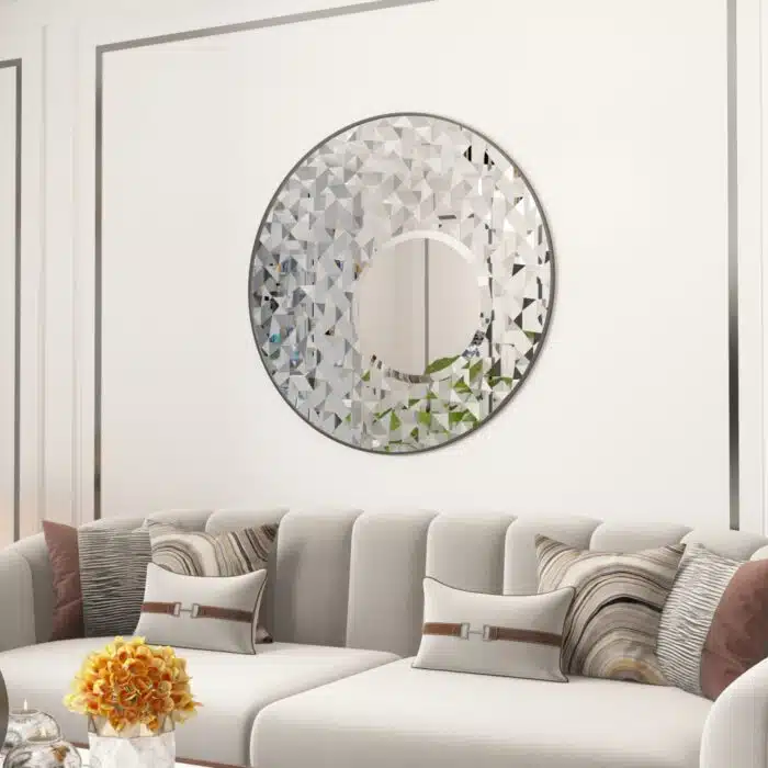 Add a touch of elegance and style to your space with this Round Asymmetrical Mirror. Perfect for your living room decor or as a statement piece in your bathroom, this large circle wall mirror will bring a unique accent to any room. The decorative sunburst style adds a modern flair while also incorporating a classic design. Elevate your home decor with this stunning mirror that will surely catch the eye of all your guests.