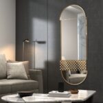 Add a touch of modern elegance to your living space with this stunning Oval Pill shaped Mirror. This Long Large Wall Mirror is perfect for the living room or any room in need of a chic update. Crafted to be a standout piece in your home decor, this Bathroom Vanity Mirror exudes sophistication and style. The asymmetrical irregular shape adds a unique touch, making it a perfect choice for an Entryway statement piece. Elevate your interior with this Stylish Modern Wall Mirror that is sure to impress guests and enhance the ambiance of your home.