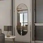 Introducing our Oval Pill shaped Mirror, a stunning addition to any chic home decor. This Long Large Wall Mirror is perfect for adding a touch of modern style to your living room or bathroom vanity. Its asymmetrical irregular shape makes it a unique statement piece for your entryway, sure to catch the eye of all your guests. Elevate your space with this Stylish Modern Wall Mirror that combines form and function beautifully. A must-have for anyone looking to add a touch of sophistication to their home.