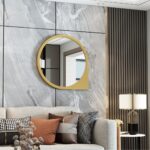 Add a touch of modern sophistication to your living space with our Asymmetrical Bathroom Vanity Mirror. This unique piece features a Round Irregular shape that adds an artistic flair to any room. The Aesthetic Long Gold Mirror frame enhances the elegance of the design, making it the perfect statement piece for your home decor. Whether you place it in your bathroom, living room, or as part of a set in your bedroom, this Unique Curved Mirror is sure to elevate your space with style and charm.