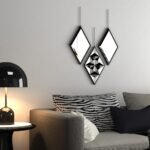 Add a touch of modern elegance to your living space with this Geometric Wall Mirror set. This set of small mirrors is perfect for adding a stylish flair to your living room decor or bathroom vanity. Handmade with care, these decorative mirrors feature a unique triangle shape and are suspended by a chic hanging chain for easy display. Elevate your wall decor with these sleek and sophisticated mirrors that will surely make a statement in any room.