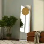 Add a touch of elegance and functionality to your living space with this stunning Standing Mirror with Clock. This floor mirror doubles up as a leaner mirror with a unique Minimal Mirror Clock design, perfect for adding a modern touch to your room décor. This Large Big wall mirror in gold black silver tones is a show-stopping piece that is sure to impress. Whether used in the living room as a focal point or in the entryway for a stylish welcome, this Elegant Designer Mirror for chic homes is a versatile addition to any room. Elevate your space with this Designer Mirror clock that also serves as a Vanity Mirror, adding both style and practicality in one exquisite piece.