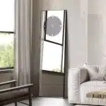 Add a touch of elegance and functionality to your living space with this stunning Standing Mirror with Clock. This floor mirror doubles as a leaner mirror with a unique Minimal Mirror Clock design, making it a statement piece in any room. The combination of modern style and timeless appeal makes this Large Big Wall Mirror a perfect addition to your home décor. The Gold, Black, and Silver finishes complement any interior, whether you place it in the living room or use it as an Entryway Mirror. This Elegant Designer Mirror is not only a chic accent piece but also a practical timepiece. Transform your space with this versatile Vanity Mirror that embodies both style and sophistication.