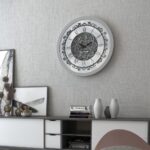 Add a touch of vintage charm to your living space with this stunning Silver Color Round Wall Clock. Featuring elegant Roman Numerals, a Curved Wood Center, and an Antique finish, this Large Wall Clock is perfect for adding a unique touch to your kitchen or living room decor. Whether you need a statement piece with this Oversized Wall Clock or a simple timepiece with this Silent Wall Clock, this Retro-inspired design is sure to impress. Don't miss out on this must-have item for anyone seeking a blend of classic and contemporary style!