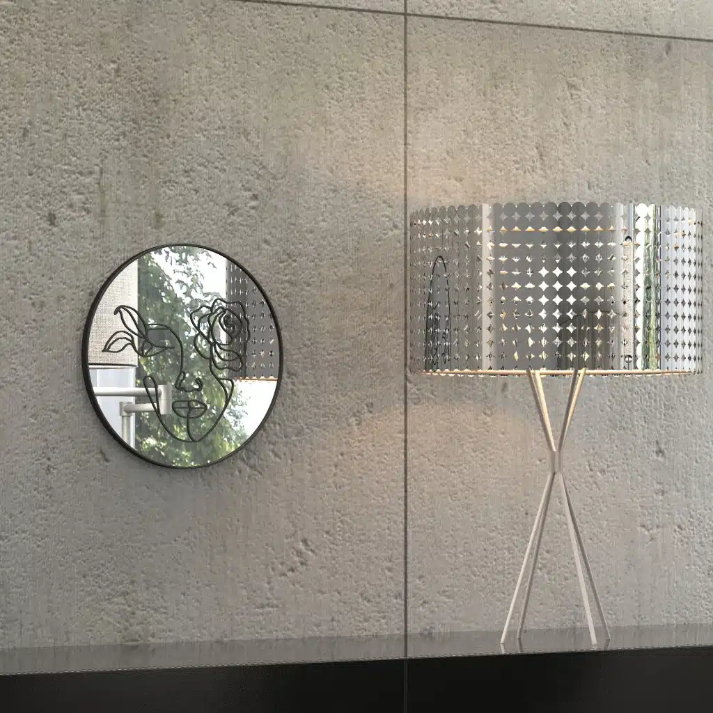 "Etched line drawing of a woman's face intertwined with a mix of flowers on a round wall mirror, showcasing intricate and artistic design."