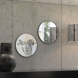 "Etched line drawing of a woman's face intertwined with a mix of flowers on a round wall mirror, showcasing intricate and artistic design."