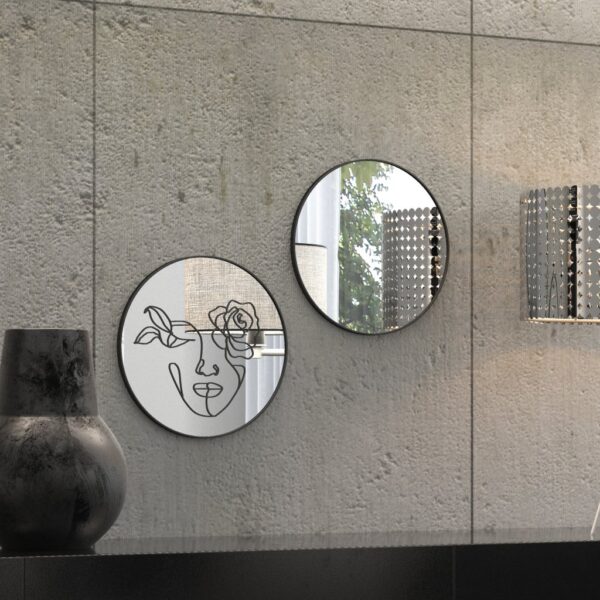 "Etched line drawing of a woman's face intertwined with a mix of flowers on a round wall mirror, showcasing intricate and artistic design."