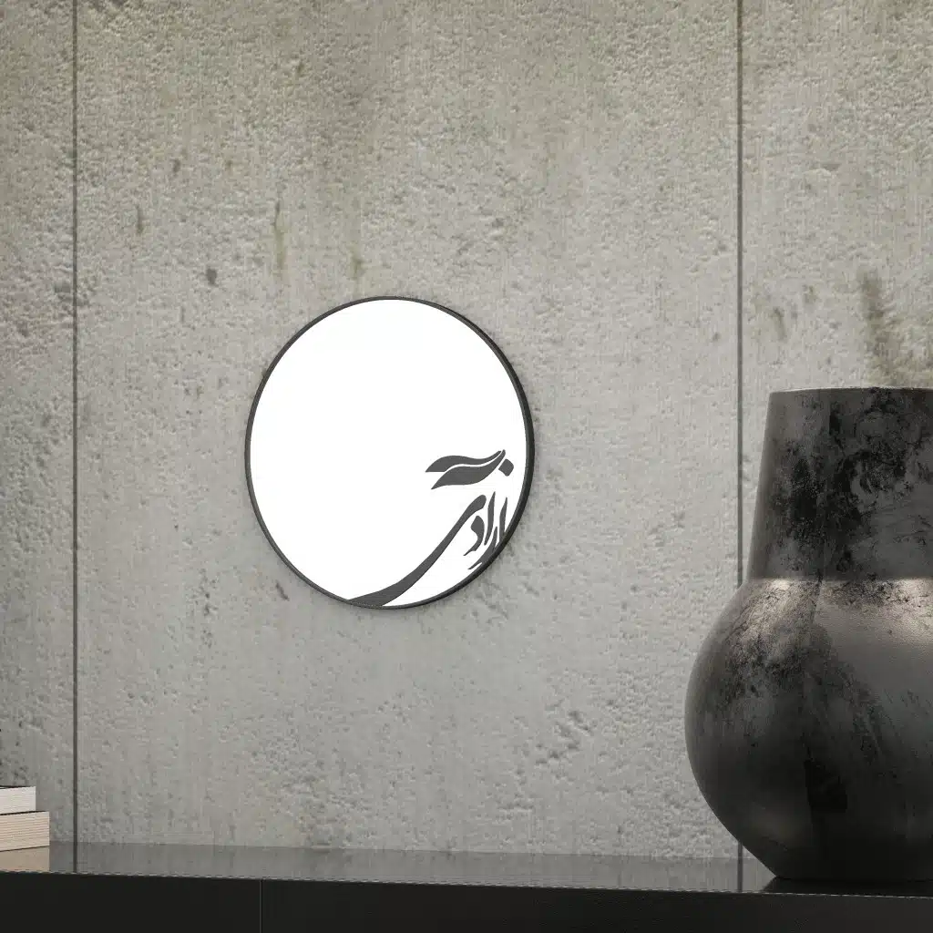Small round handmade wall mirror with Persian calligraphy design featuring the word 'Freedom' etched on the mirror surface, available with black or gold frame.