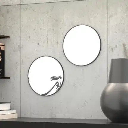 Small round handmade wall mirror with Persian calligraphy design featuring the word 'Freedom' etched on the mirror surface, available with black or gold frame.