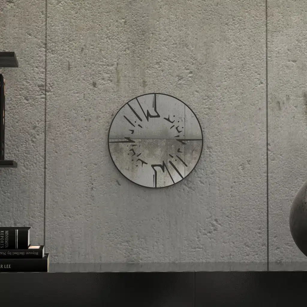 Small round wall mirror with an etched Persian calligraphy design featuring the words 'Women, Life, Freedom,' framed in a gold and black color scheme, hanging on a wall.