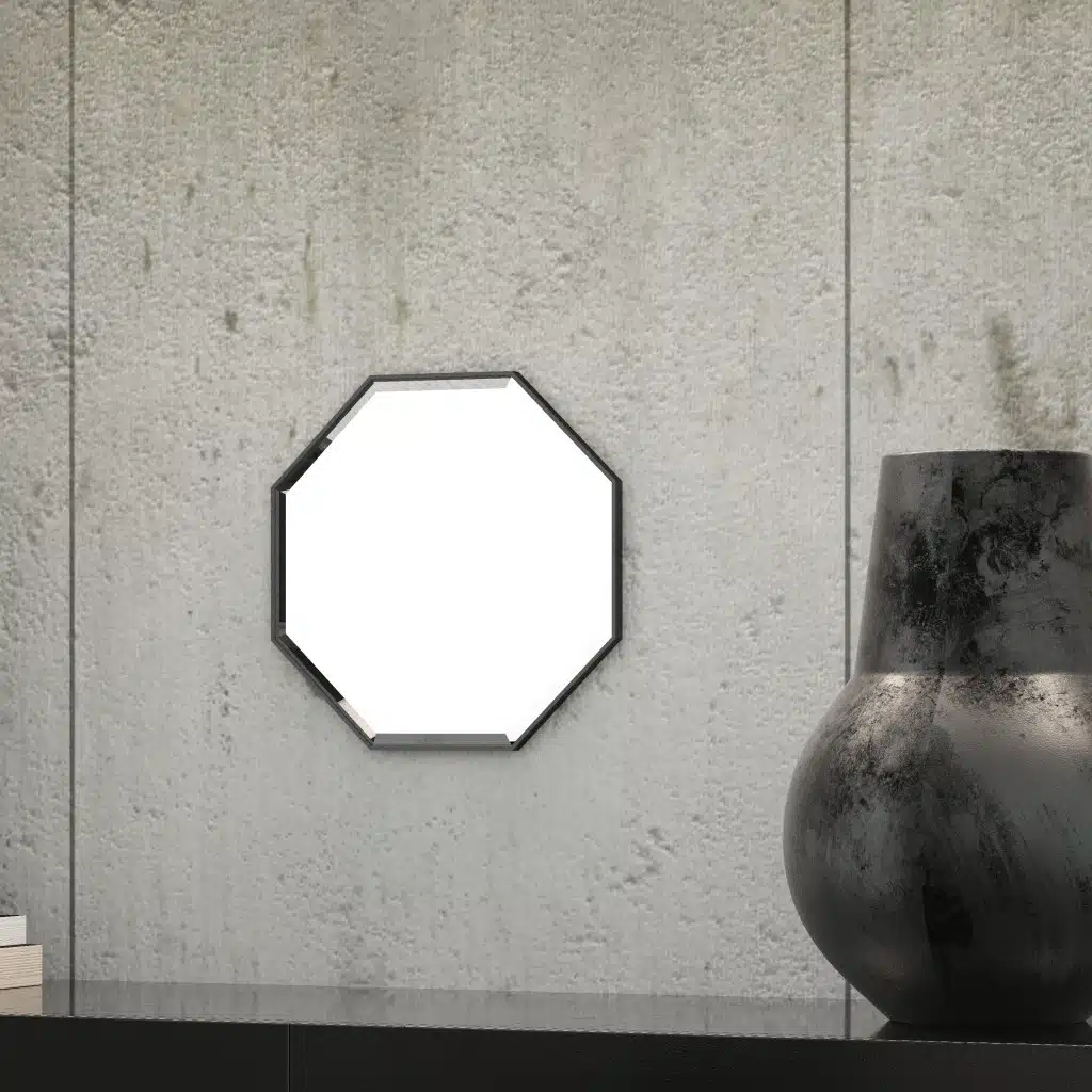 A octagonal wall mirror elegantly mounted on a wall adjacent to a well-stocked bookshelf, enhancing the room's aesthetic appeal.