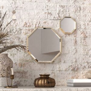 A octagonal wall mirror elegantly mounted on a wall adjacent to a well-stocked bookshelf, enhancing the room's aesthetic appeal.