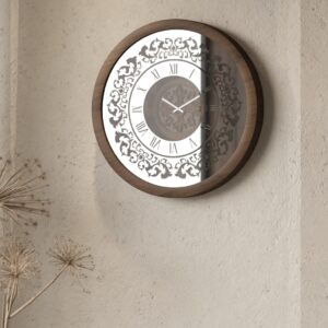 Handmade round wall clock with a wooden frame in walnut patina, mirrored glass front featuring Roman numerals, and a floral carved wood center, perfect for elegant home decor.