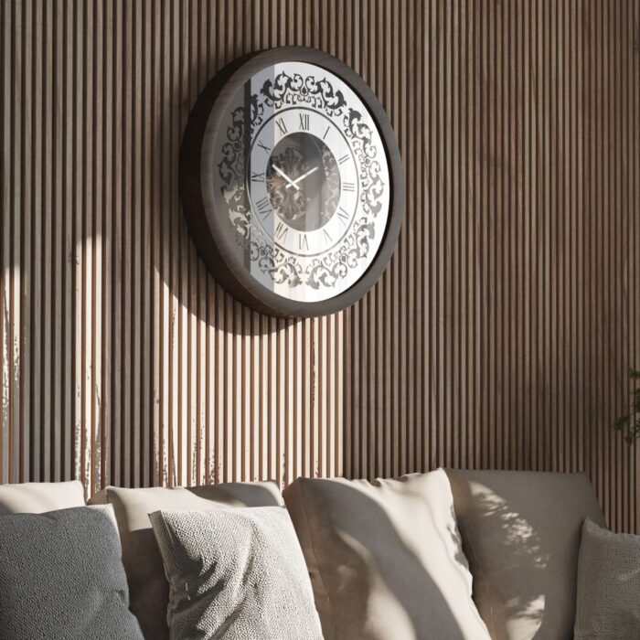 Handmade round wall clock with a wooden frame in walnut patina, mirrored glass front featuring Roman numerals, and a floral carved wood center, perfect for elegant home decor.