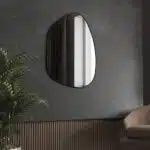 Irregular-shaped wooden frame wall mirror with asymmetrical design, perfect for modern home décor and bathroom vanities