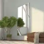 Full-length angled wall mirror with beveled diagonal lines and frameless design, available with black, gold, or silver wood backing.