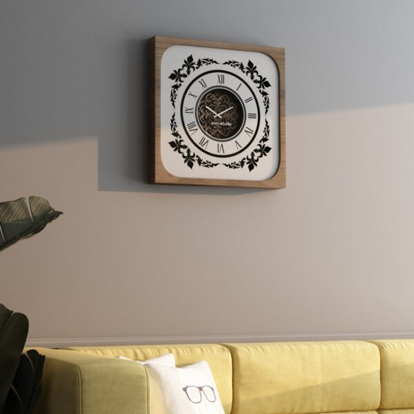 Handcrafted square oversized wall clock featuring a walnut patina wooden frame, mirrored glass face with Roman numerals, and an intricate floral wood center design. Perfect for stylish home decor