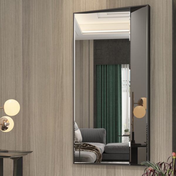 Luxurious full-length wall mirror with a sleek wooden frame, available in black with black-tinted mirror paneling and gold with rose-gold tinted mirror. Featuring a unique half-and-half design with precision beveled edges and an inward angle for a layered effect, this designer mirror adds depth and elegance to modern and classic interiors alike. Ideal for entryways, living rooms, and bedrooms as a functional art piece.