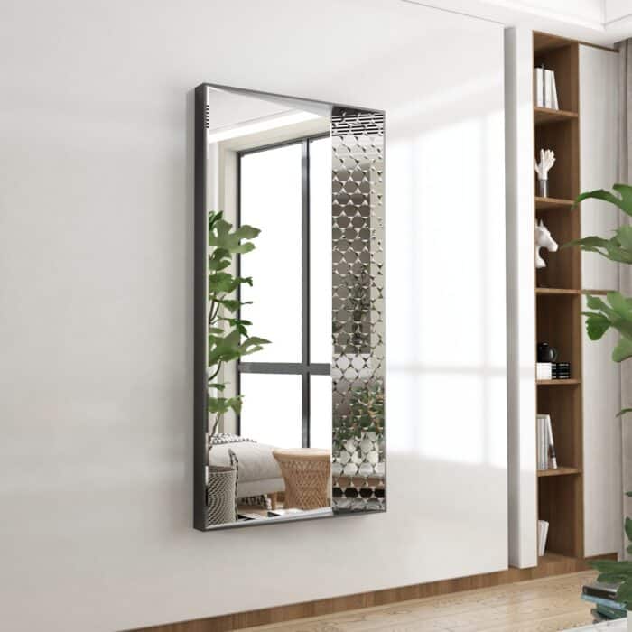 Large wall mirror with black and rose gold wooden frame featuring distinctive handcrafted prism-shaped paneling, creating a 3D effect. Ideal for enhancing luxury decor in living rooms