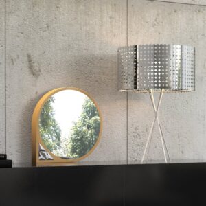 Unique tabletop mirror with asymmetrical frame and prism artwork in a stylish dressing room.